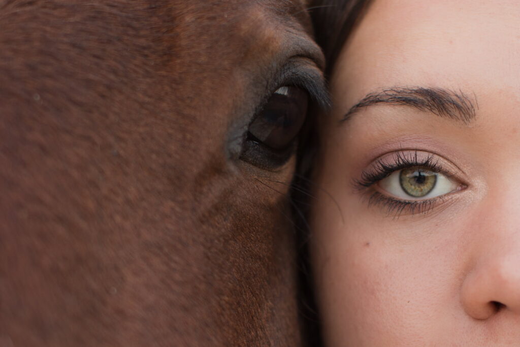 senior girl eye to eye with her horse