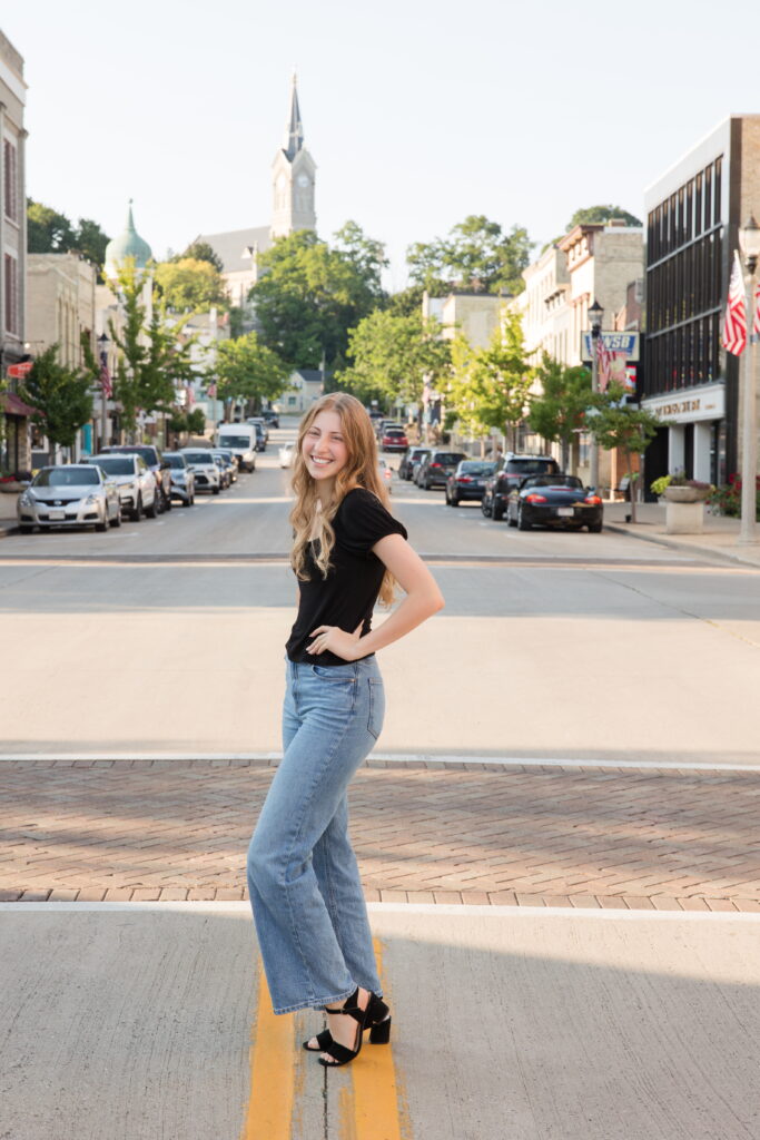 senior girl standing in the road