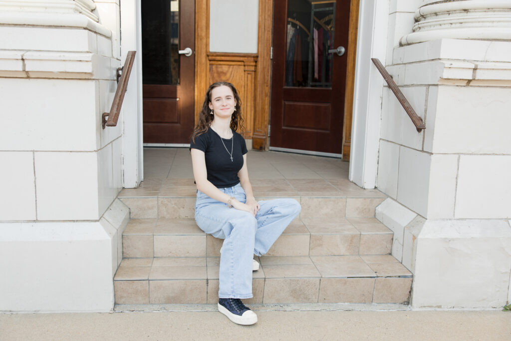Senior girl seated on steps